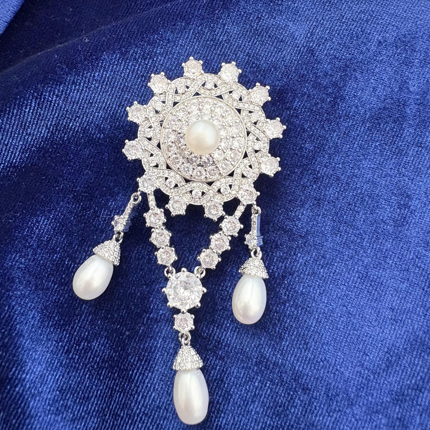 replica of the teck corsage brooch worn by queen elizabeth ii with freshwater pearls and cubic zirconia