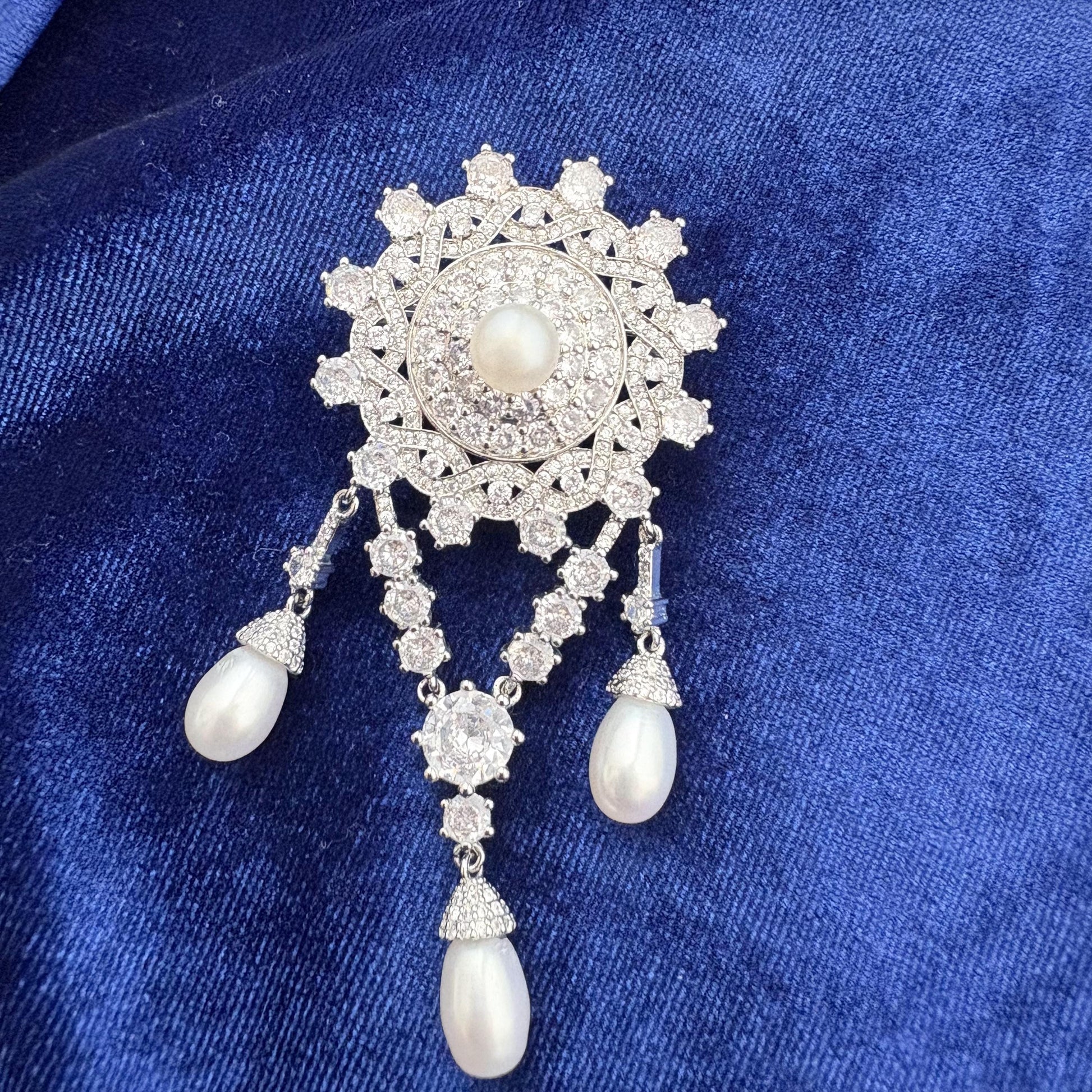 replica of the teck corsage brooch worn by queen elizabeth ii with freshwater pearls and cubic zirconia