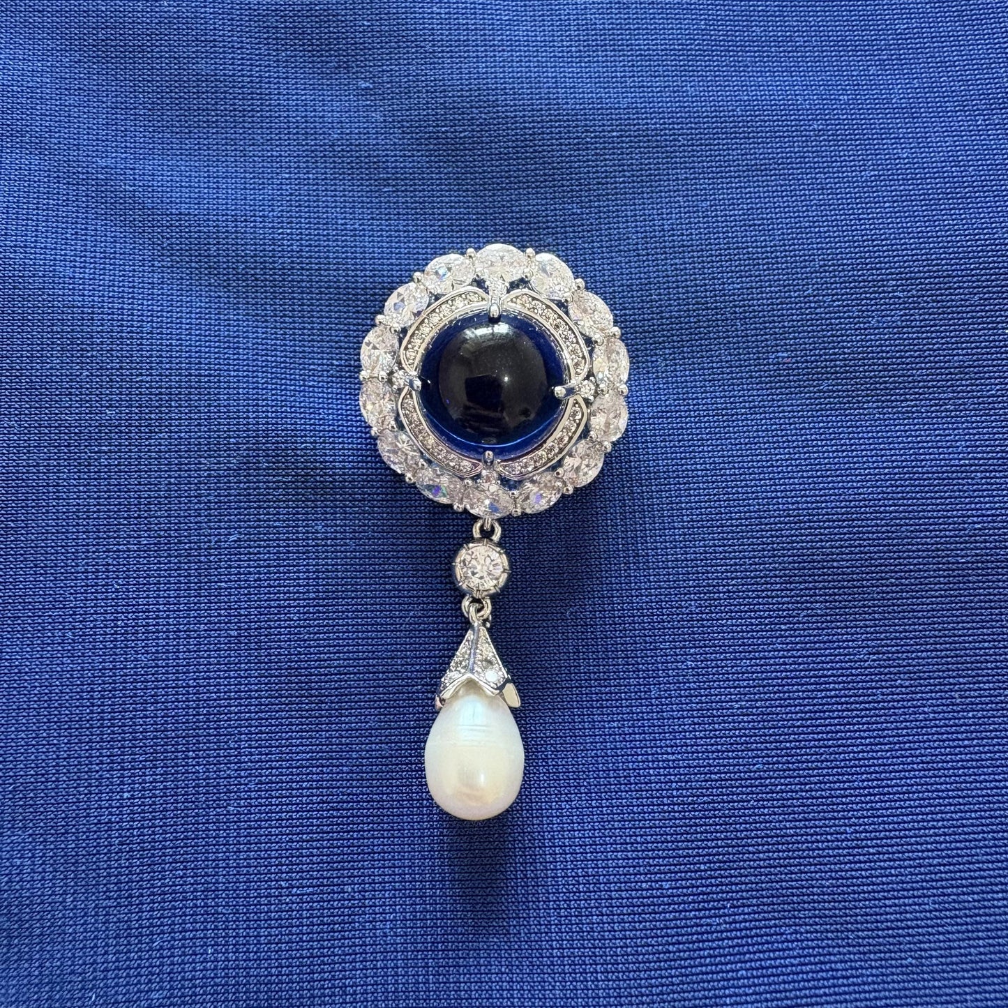 sapphire blue gemstone cubic zirconia round brooch with dangling pearl